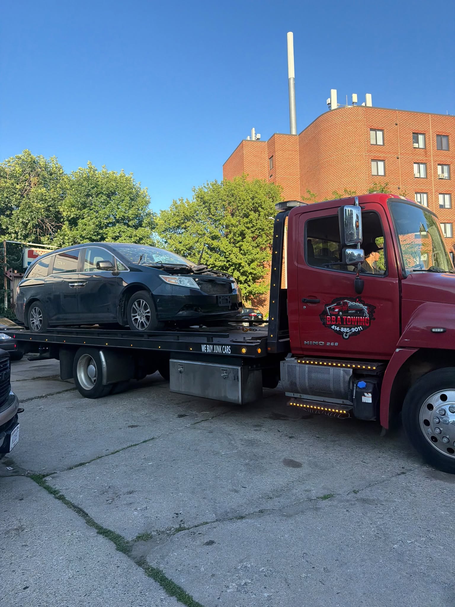 BBA Towing flatbed transporting a vehicle in Milwaukee